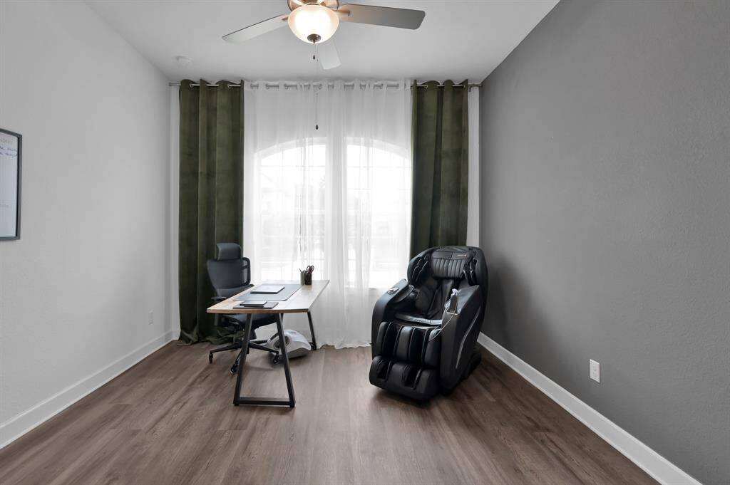 1st floor bedroom with LVP flooring. Currently used as a second office.
