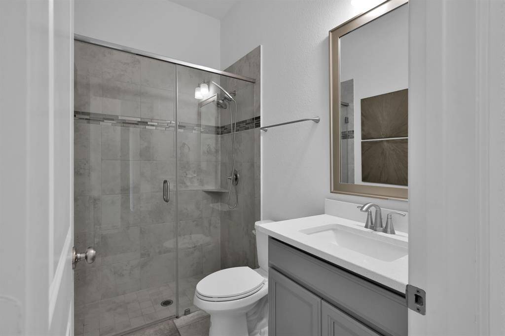 Semi-frameless shower. Adjacent to the second bedroom on the 1st floor.