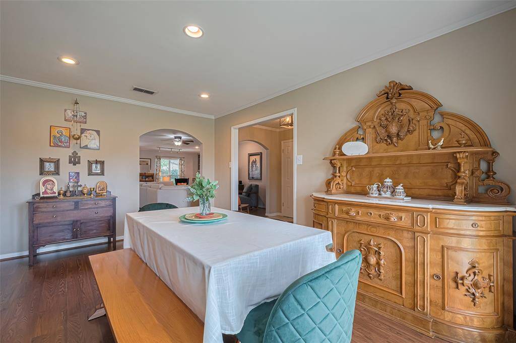 The formal dining room has space for all of your special pieces of furniture and art