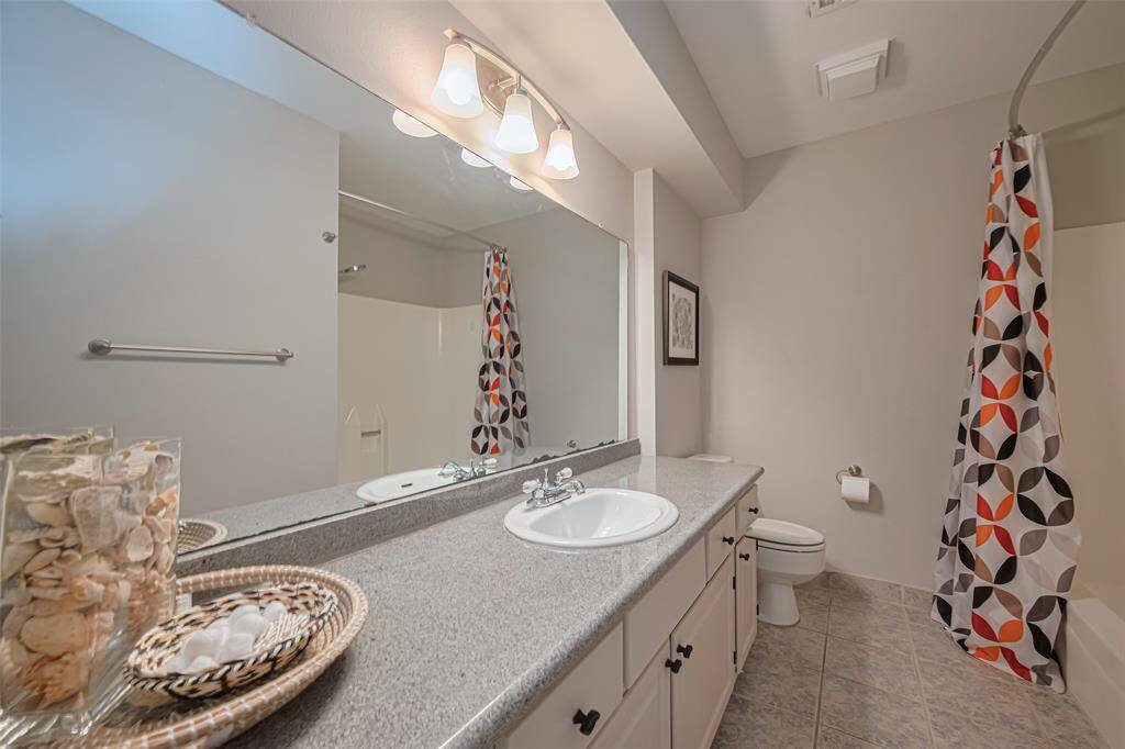 Main bath is located in the hall off of the main living area. Lots of cabinetry and linen closet