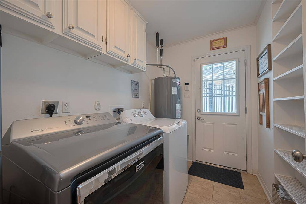 Laundry and Utility space inside home with extra pantry storage
