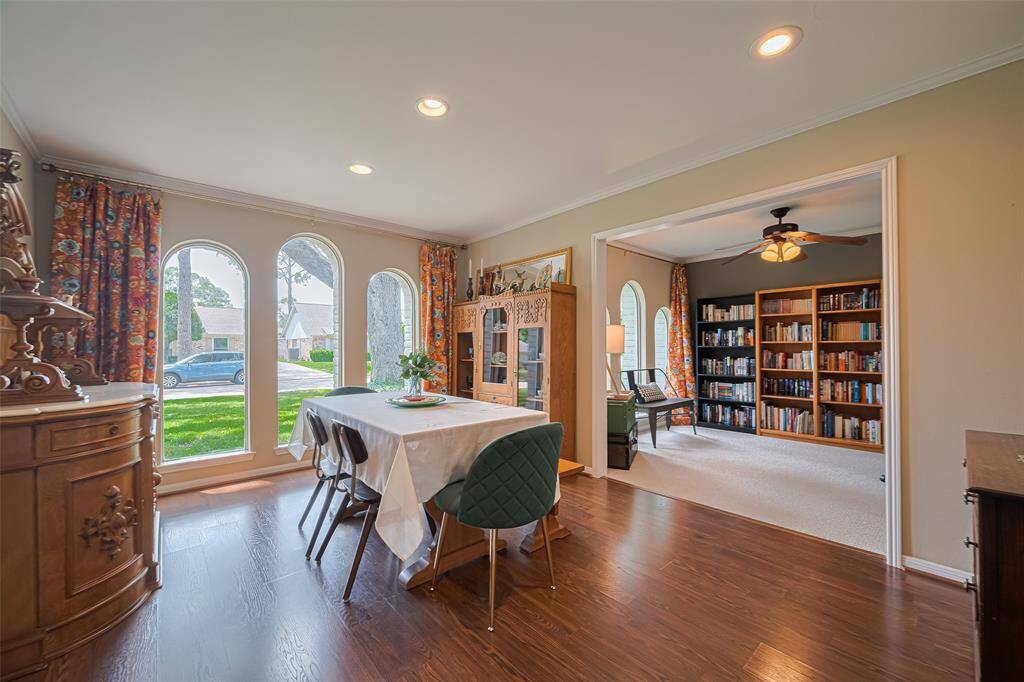 Spacious formal dining with beautiful windows and space for any hutch or larger dining room suite for family gatherings. Open to the den/office or sitting area for reading or work. The window treatments add color and fun to the space