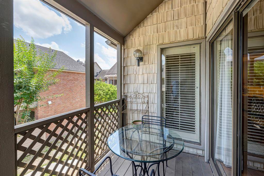 The private, covered balcony offers views of the courtyard.