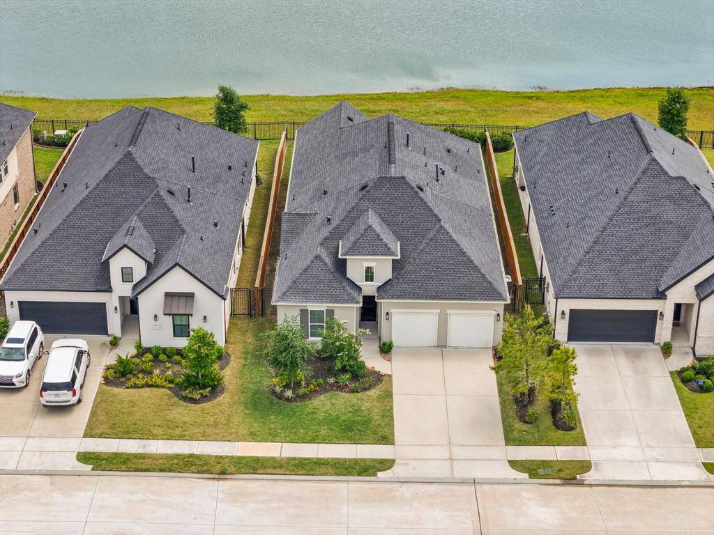 Beautiful lakefront property with immaculate curb appeal! Enjoy direct water views and a spacious 2-car garage in this well-maintained modern home.