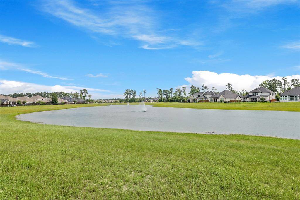 Peaceful lake views with dual fountains provide a beautiful natural backdrop and added privacy.