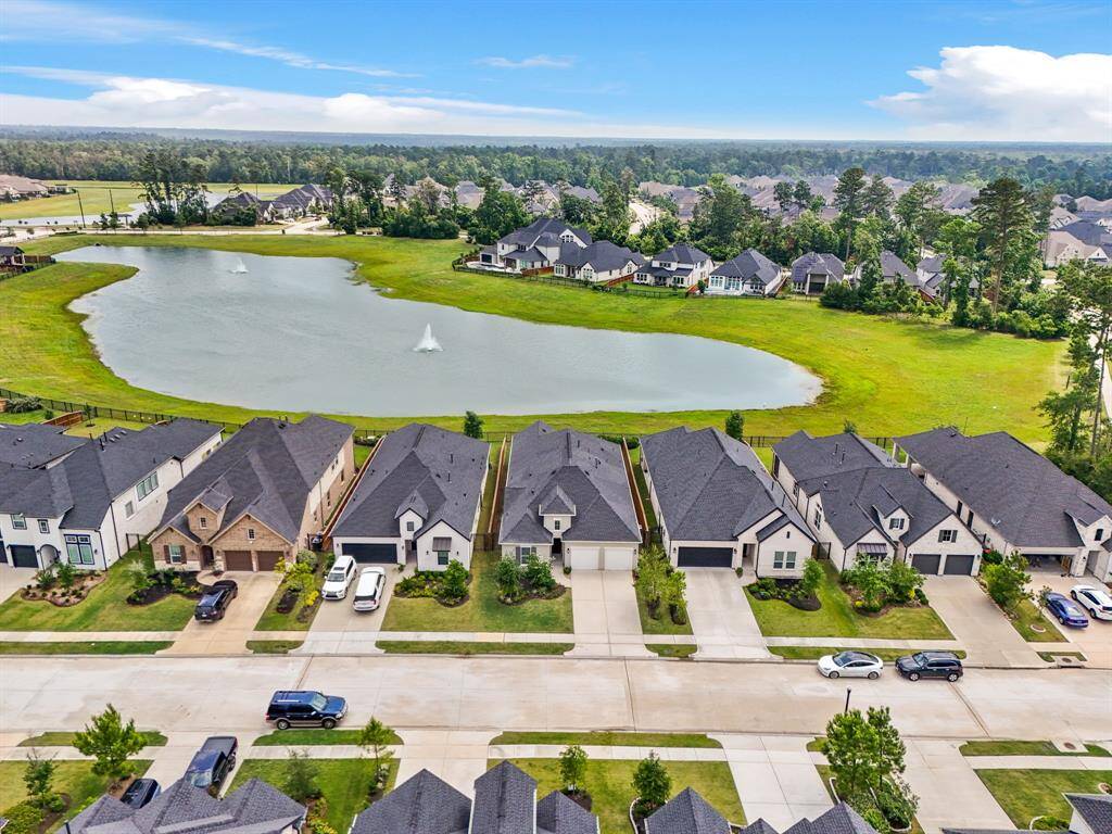Scenic aerial view showcases the serene lakefront setting—an everyday retreat right in your backyard.