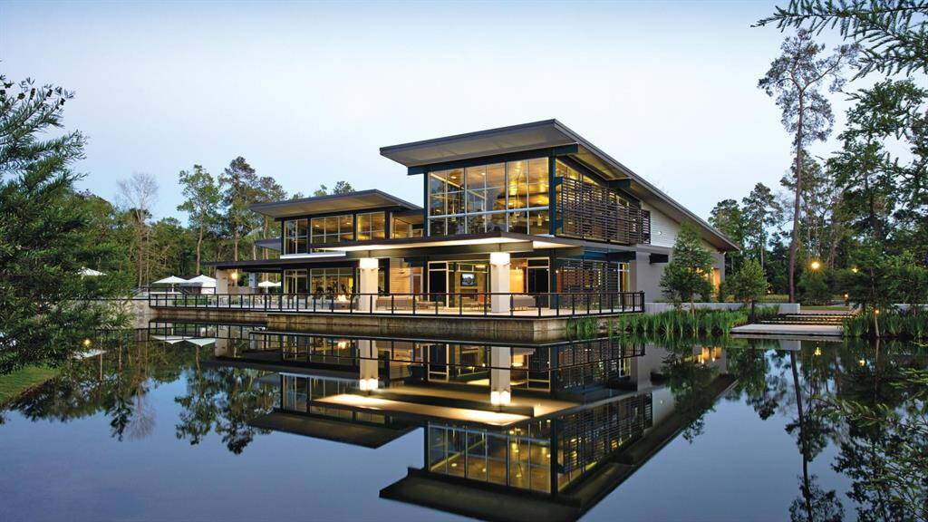 Striking architecture meets natural serenity in this elegant clubhouse, beautifully reflected in the surrounding water, creating a stunning focal point in the heart of the community.