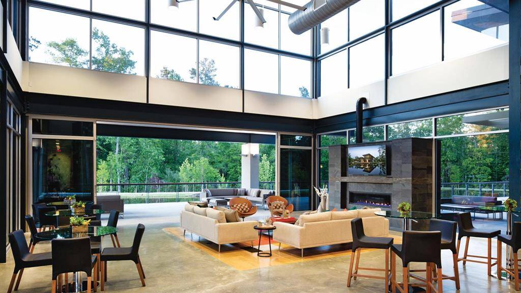 The Woodson’s Reserve clubhouse offers a sleek and modern interior with soaring ceilings, abundant natural light, and comfortable lounge areas—perfect for relaxing or hosting events.