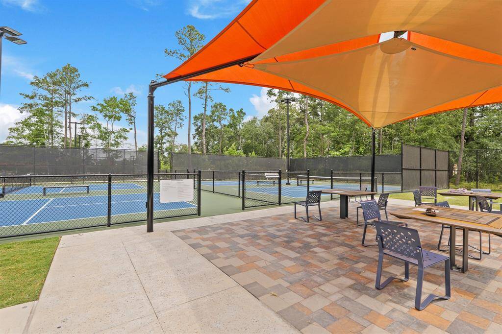 Well-maintained pickleball and tennis courts with shaded seating areas offer a great place to stay active and socialize with neighbors.