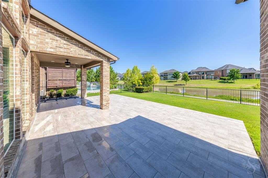 A beautiful blend of brick and stone welcomes you to this stately residence with impressive curb appeal. The expansive driveway leads to a 3 car garage, including a separate single bay - perfect for additional storage or a weekend vehicle.
