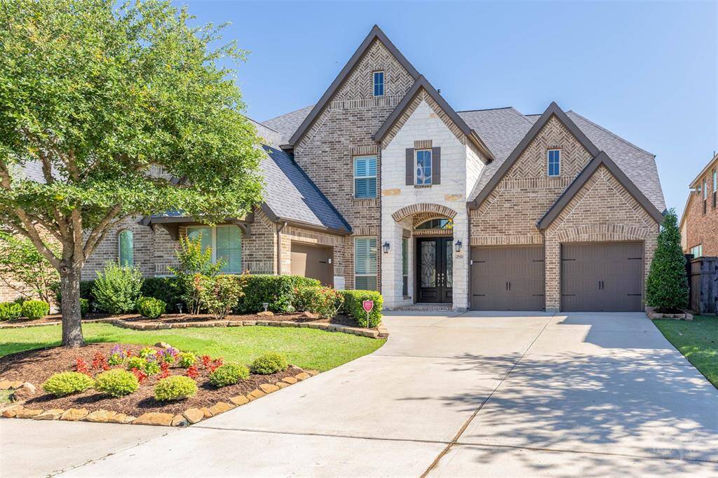 This stunning luxury home makes a grand impression with its exquisite brick and stone elevation, arched entryway, and expansive 3 car garage. Meticulously landscaped gardens and a stately double front door set the tone for upscale living.