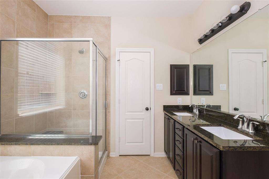primary bath, separate shower and bath, with 2 sinks.