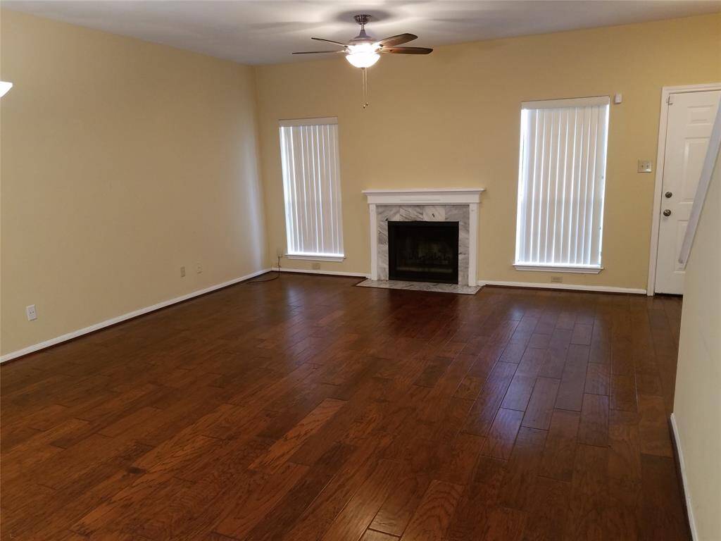 Spacious den with fireplace.