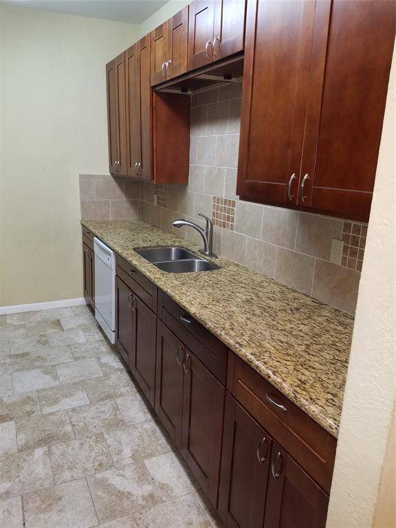 Granite counters with cherry cabinets.
