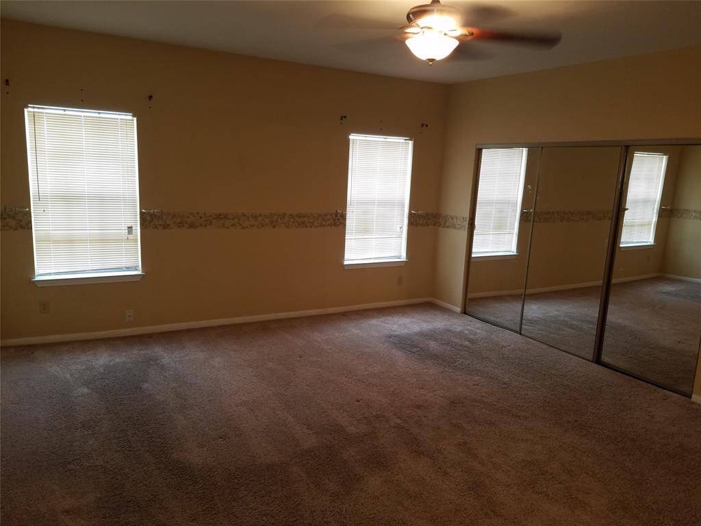 Master suite with a large closet behind all three doors.