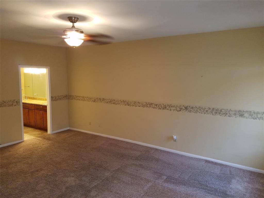 Master suite with entrance to the private bath.