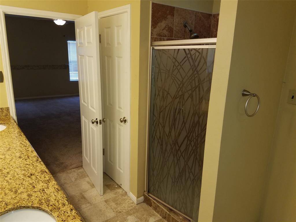 Master bath with seperate walk in bath.