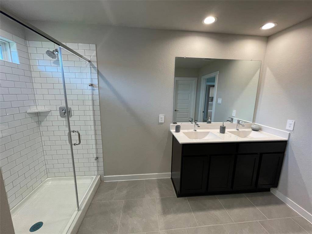 Primary bathroom with extended shower.