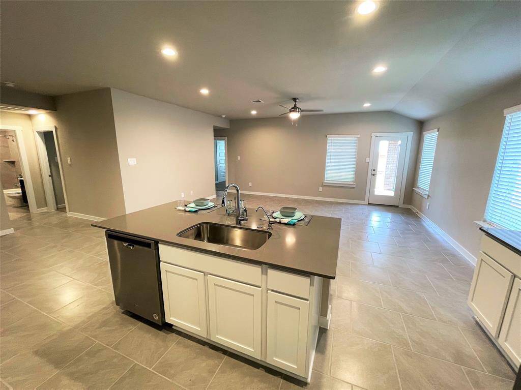 Kitchen breakfast island open to the family room.