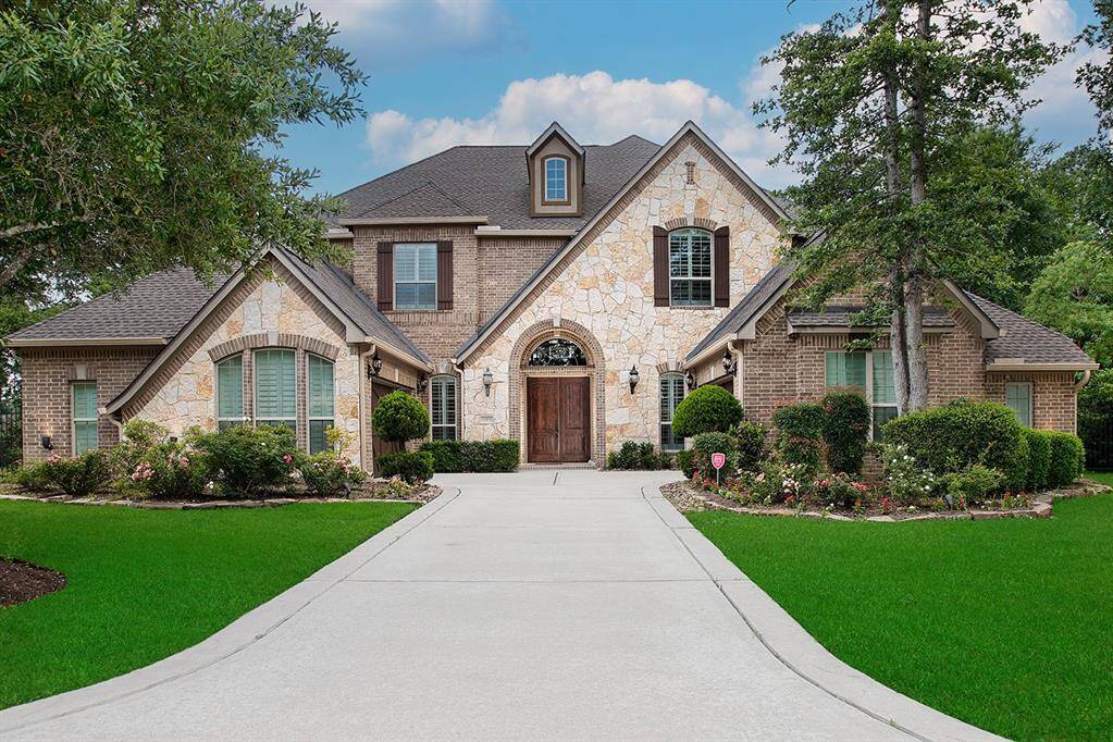 Stunning home on a coveted cul-de-sac with sweeping golf and water views