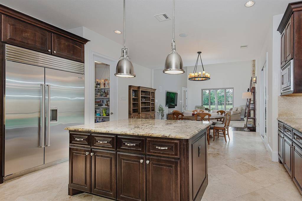 Premium appliances include dual door Subzero refrigerator