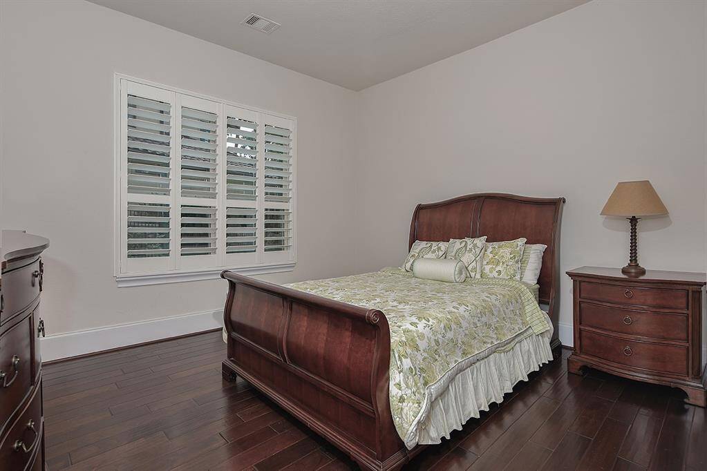 Private, guest en-suite bedroom #2 with wood floors