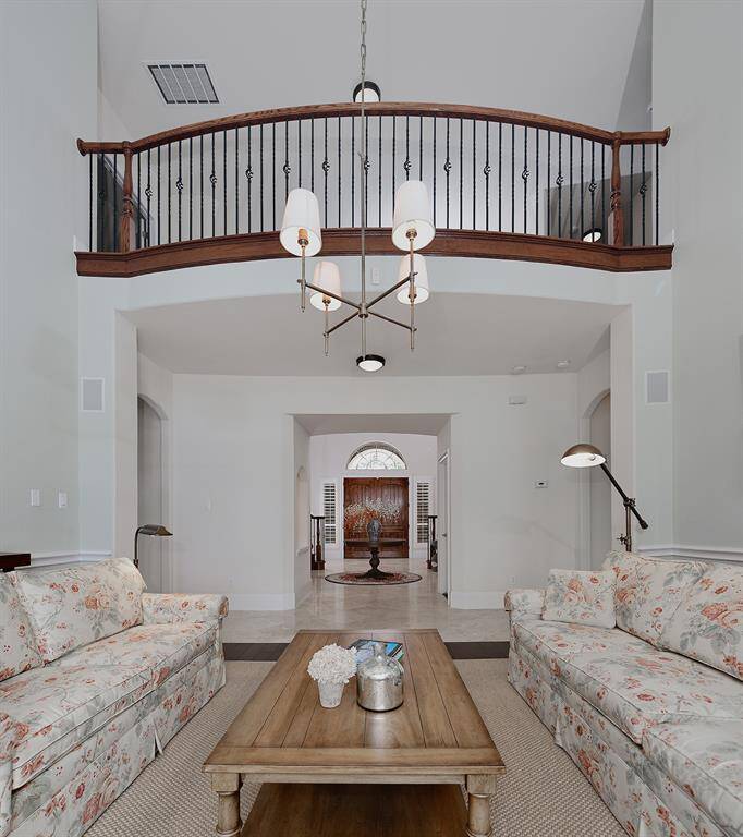 Home features soaring ceilings and modern lighting