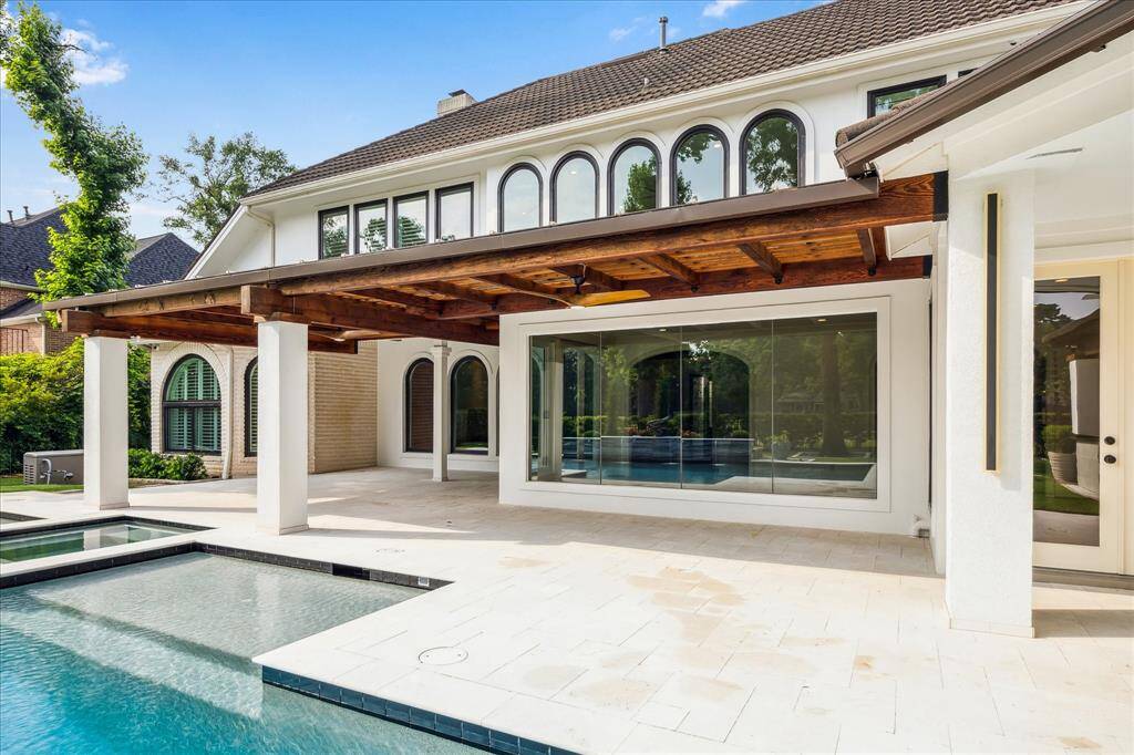 Another stunning angle from the backyard—oversized covered patio, endless green views, and pure tranquility.