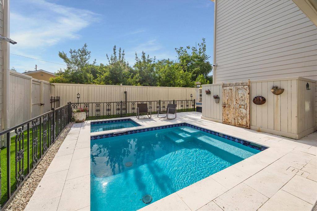 The covered stone paver patio with outdoor kitchen was added in 2019 and boasts a 42” 5 burner Blaze grill, side burner, Blaze refrigerator, sink, two fans and 2 built-in storage cabinets.