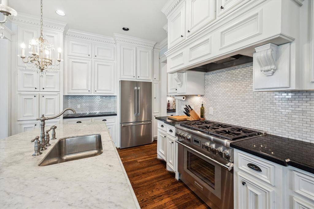 The kitchen is open to the living room making it easy to cook while entertaining or keeping an eye on loved ones.