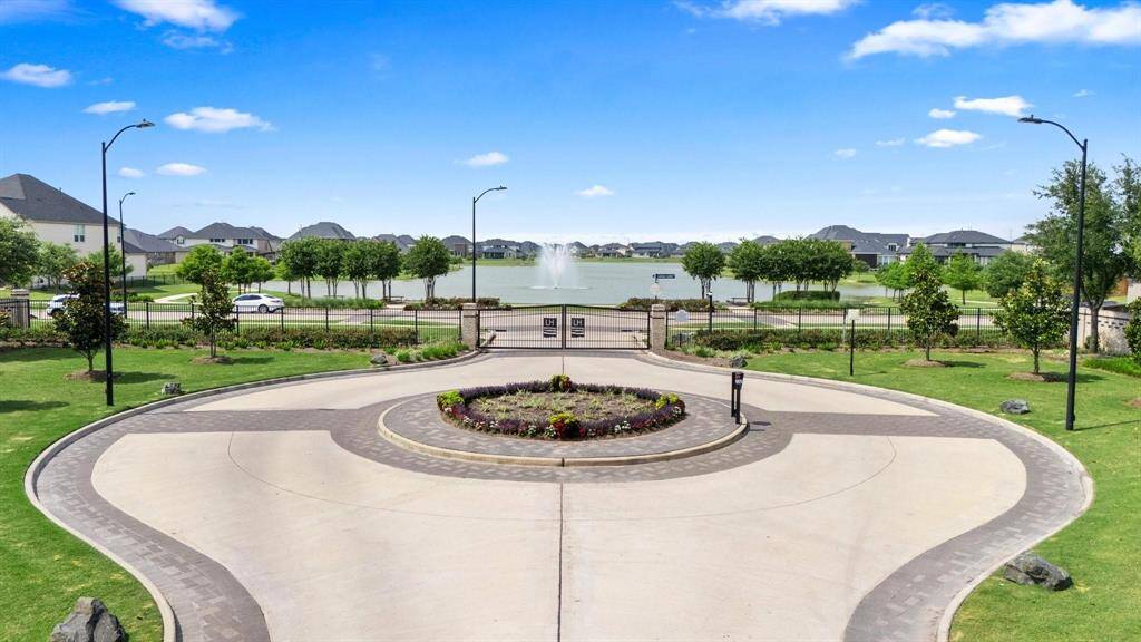Beautifully designed roundabout entry welcomes you with manicured landscaping and upscale neighborhood charm.