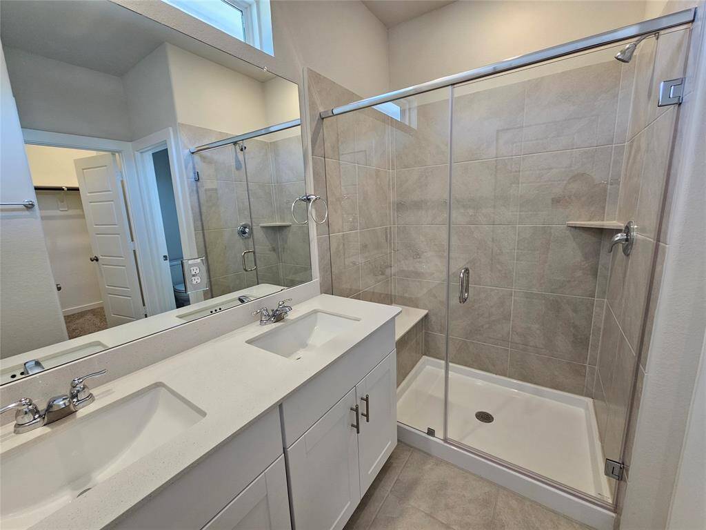 Master Bathroom with double sink and shower