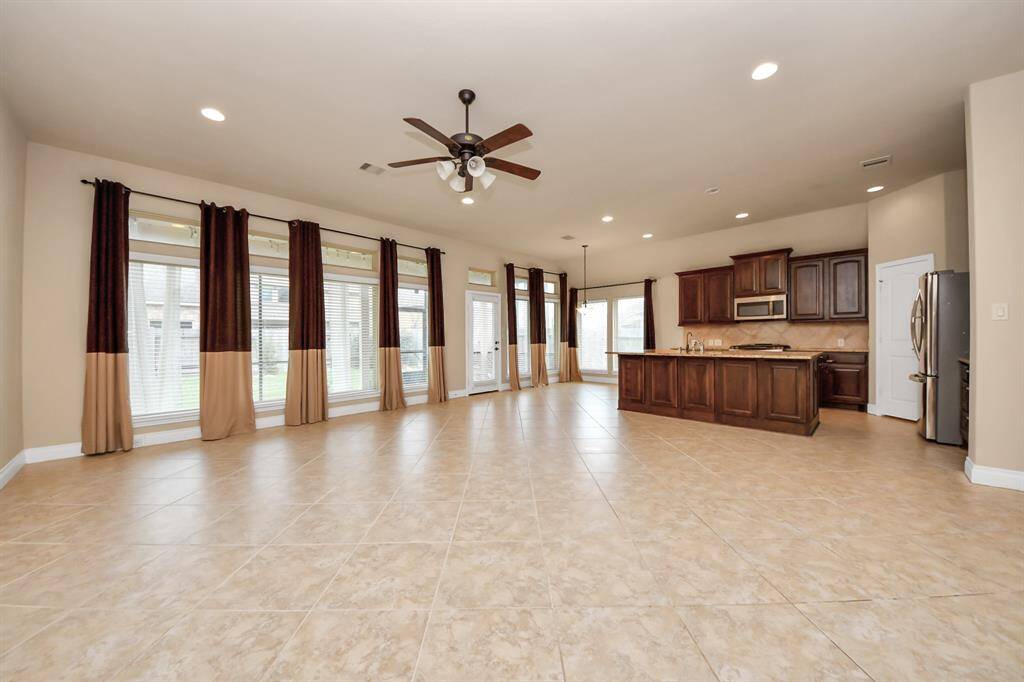 The layout includes a formal living room and a formal dining room.