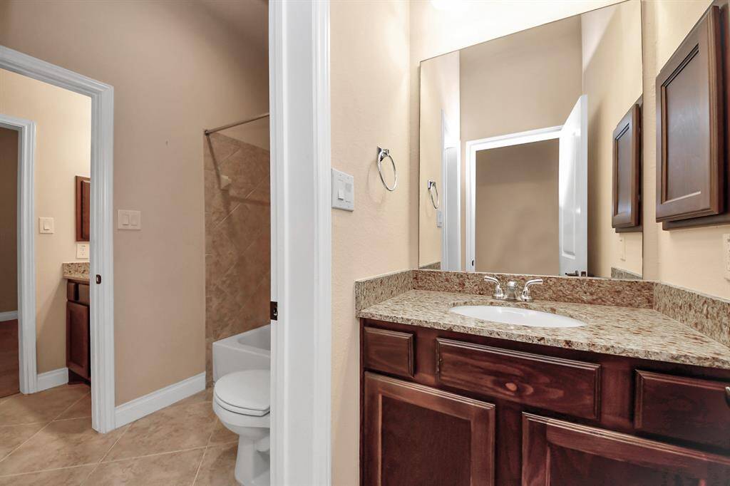 The master bathroom boasts a luxurious extra-large garden tub, creating your personal spa