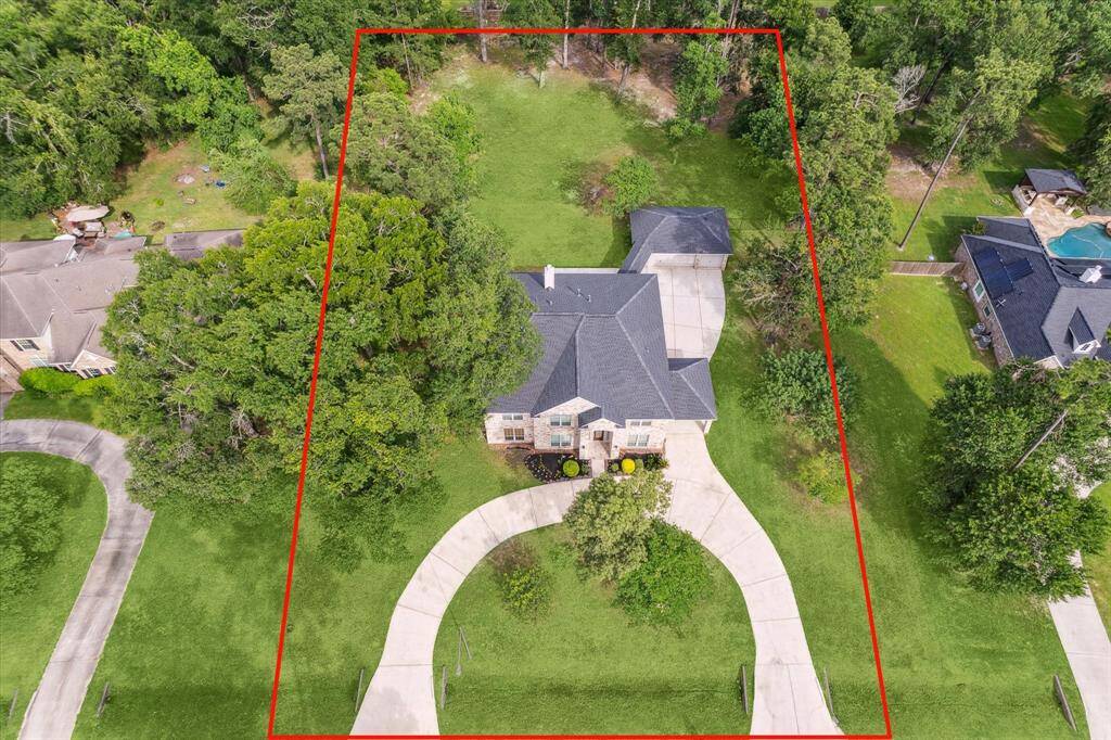 Aerial view of home, buyer should verify boundaries.