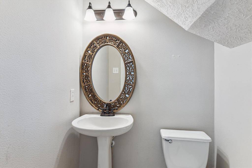 Downstairs features a half bath conveniently located for all your guests.