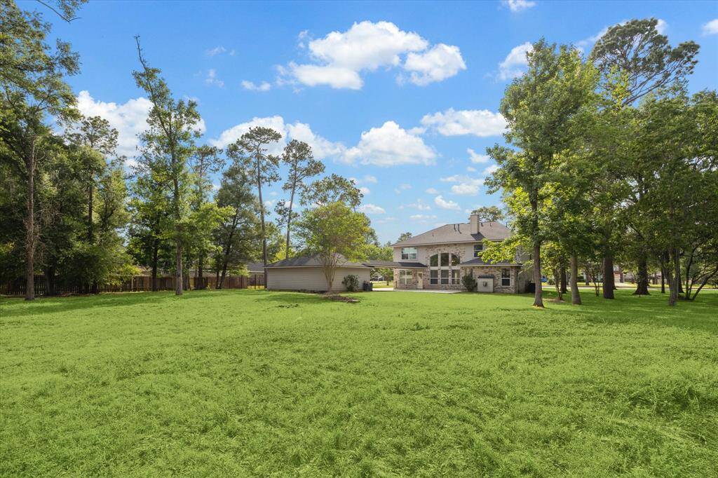 Expansive 1+ acre lot offering endless possibilities for outdoor living and enjoyment.