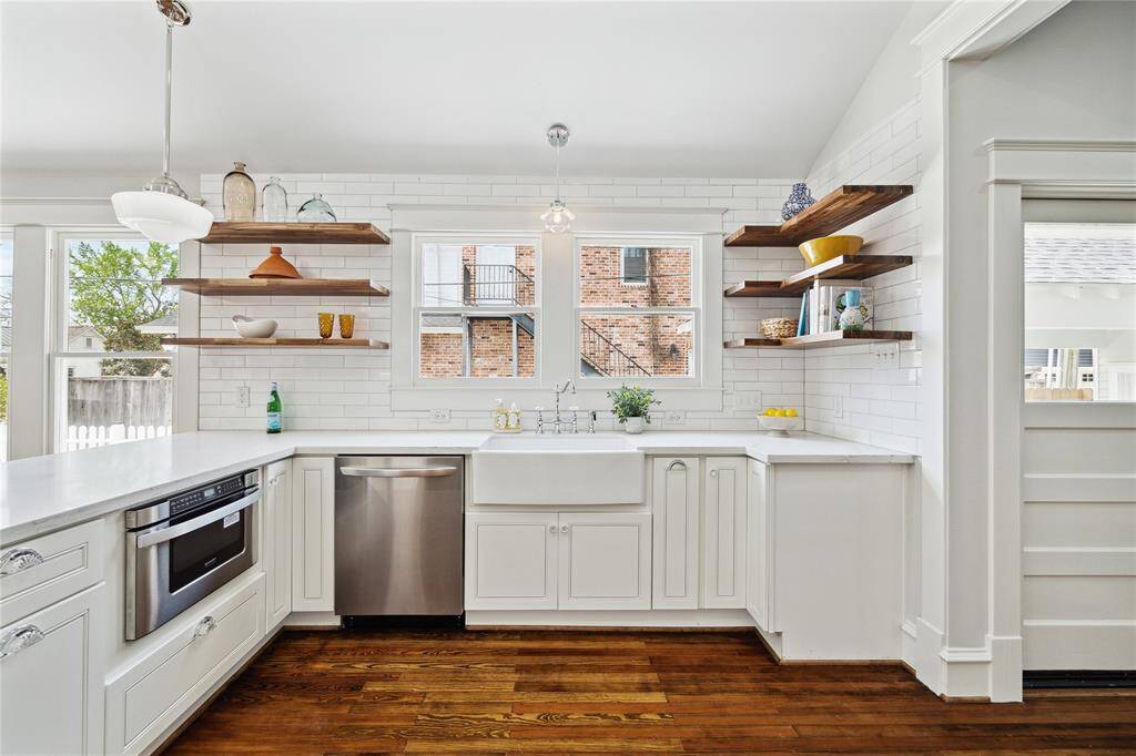 Open shelving is on one side to display our colorful china, cookbooks or tchotchkes.  Lots of natural light, too!