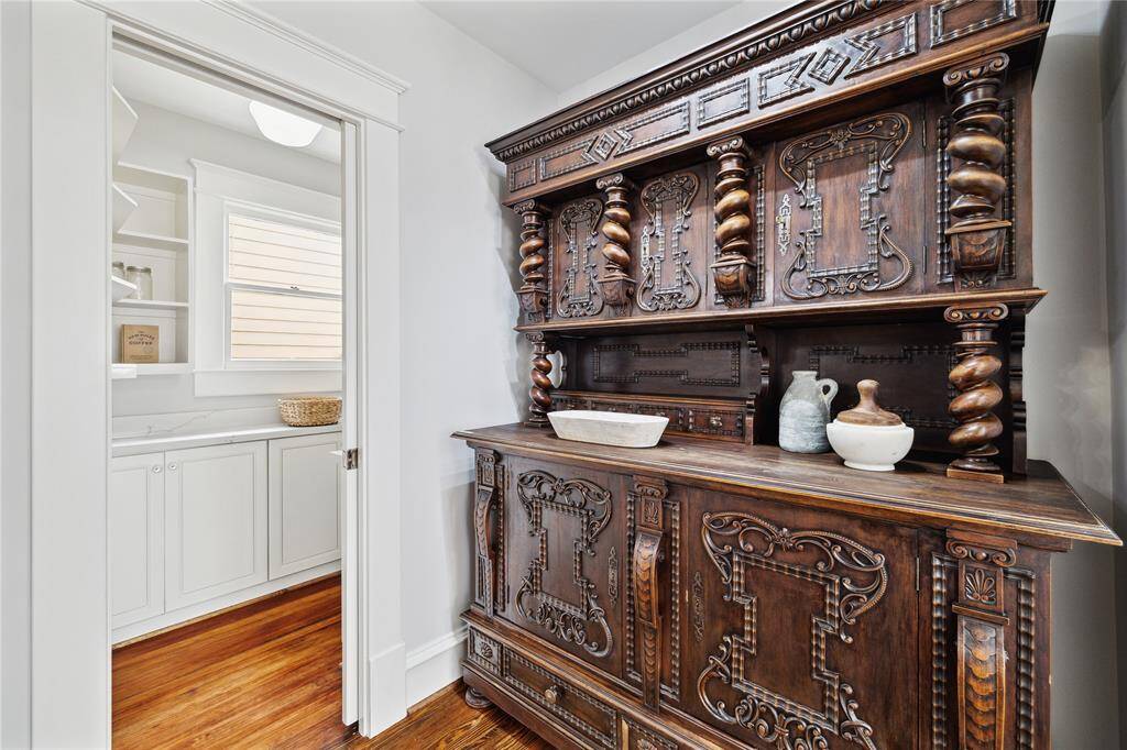 On your way to the walk-in pantry is this beautiful antique movable "built-in" that makes a great addition, whether used as a side board for your dining room or a serving piece/butler's pantry adjacent to kitchen.  This conveys with the home.