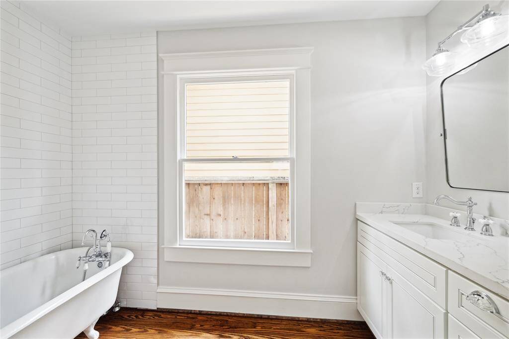 This full bath is conveniently adjacent to 4th bedroom/dining room.