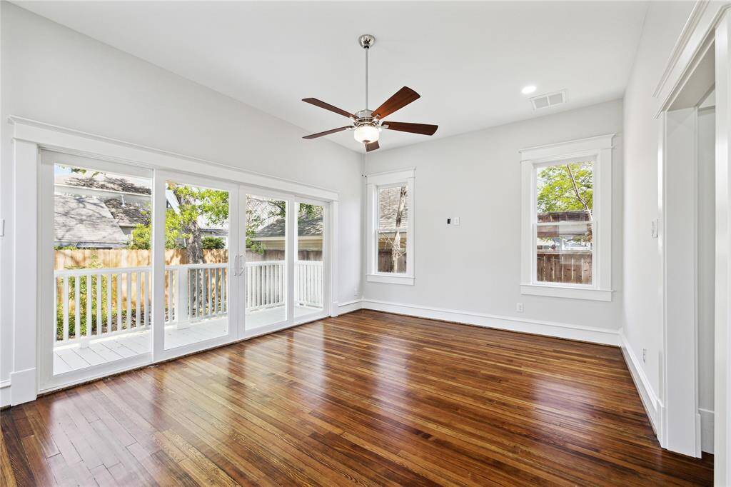 The large downstairs Primary Suite has high ceilings, hardwood floors and lovely garden views....