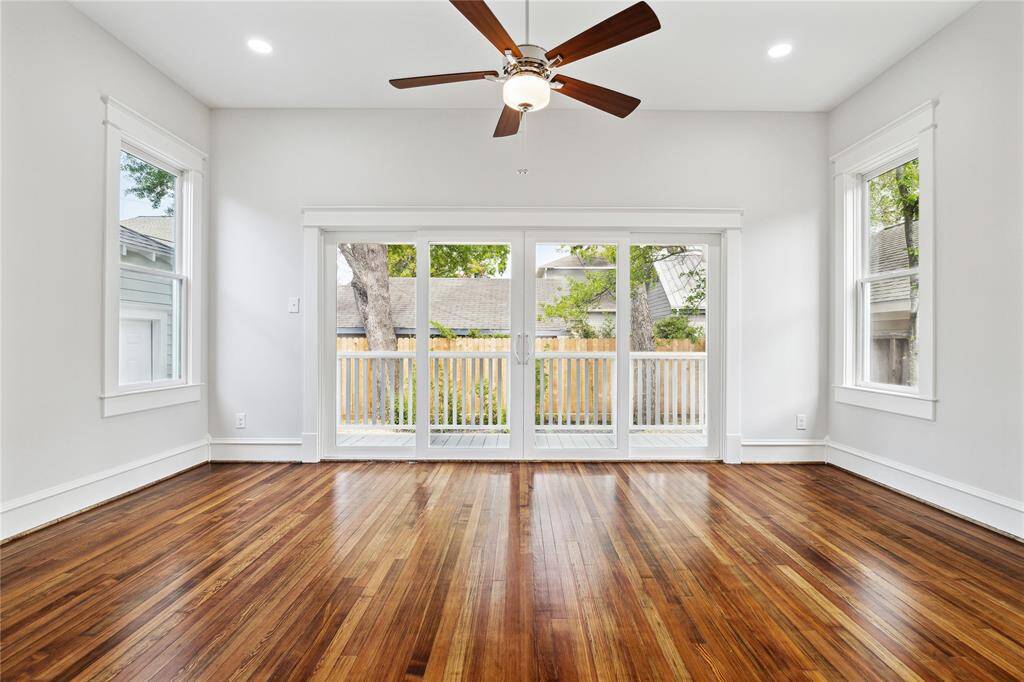 ...with large sliding glass door onto back porch overlooking the garden.