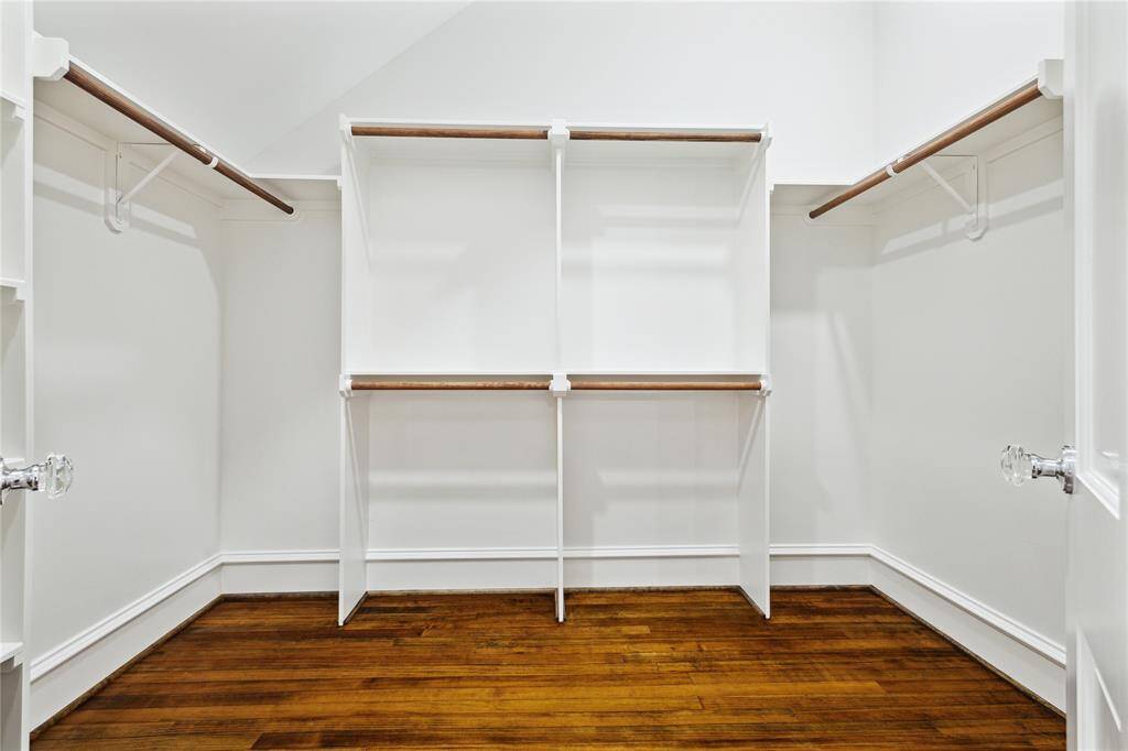 Large Primary closet is larger than this photo allows and has plenty of room for all of your clothes and shoes.