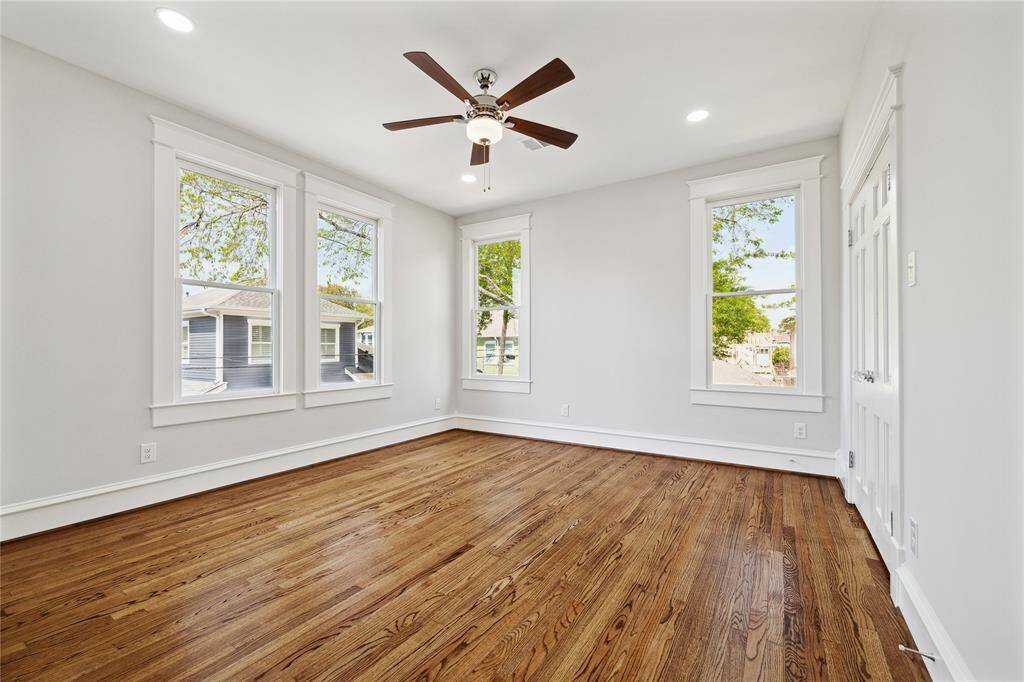 The second floor Primary Suite has high ceilings, oak hardwood floors, walk-in closet, and....