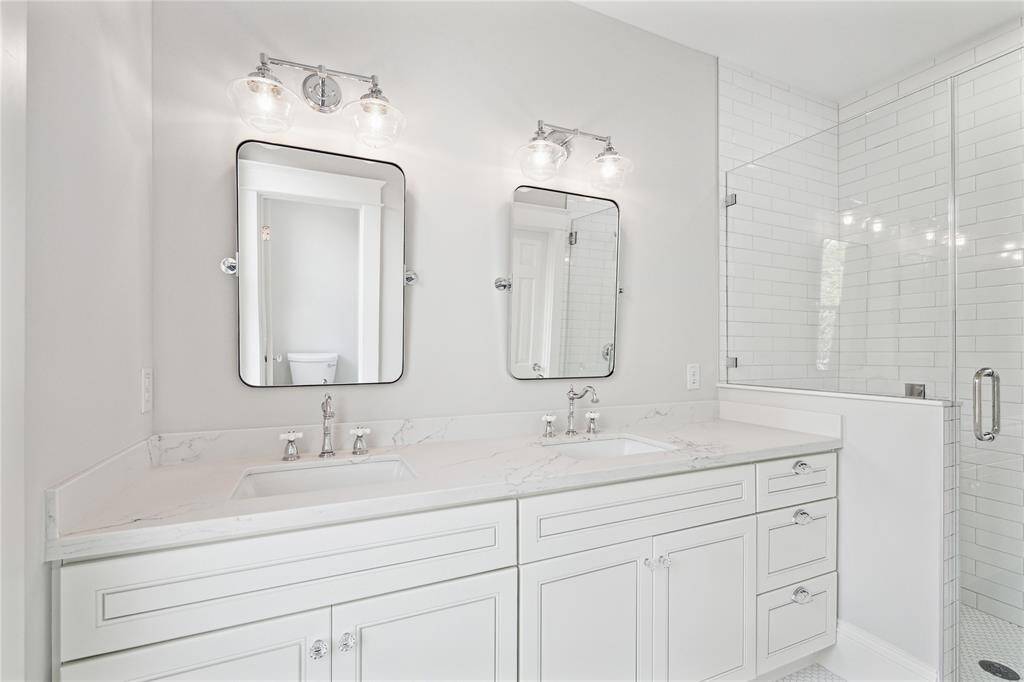 ....ensuite bath with double vanity, water closet and large walk-in shower.