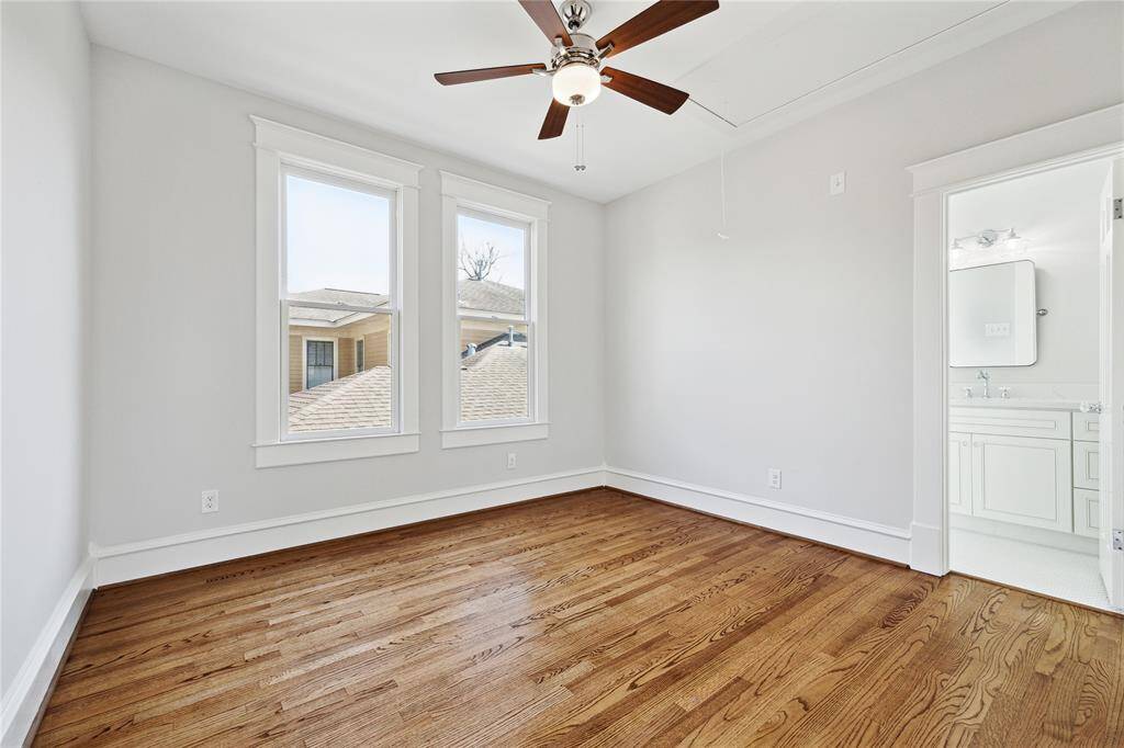 Hardwood floors and ensuite bath and walk-in closet make this room perfect as a guest suite!
