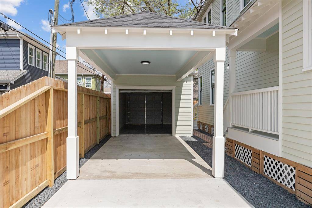 Carport provides extra cover for second car.