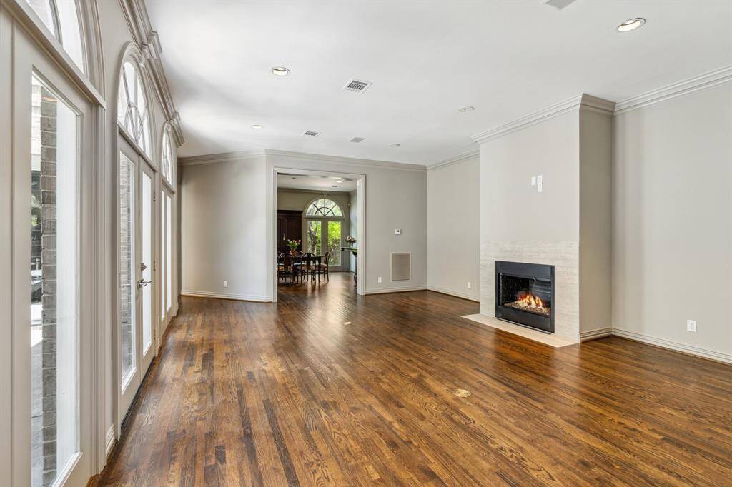 The large Family Room (22 x 18) has three sets of double French doors (2-fixed and 1-operable) to the large patio, sleek glass fireplace and ample room for multiple conversation areas.  The Family Room flows seamlessly into the Dining Room (18 x 16) and the Kitchen (15 x 12). There are "in ceiling" speakers too!