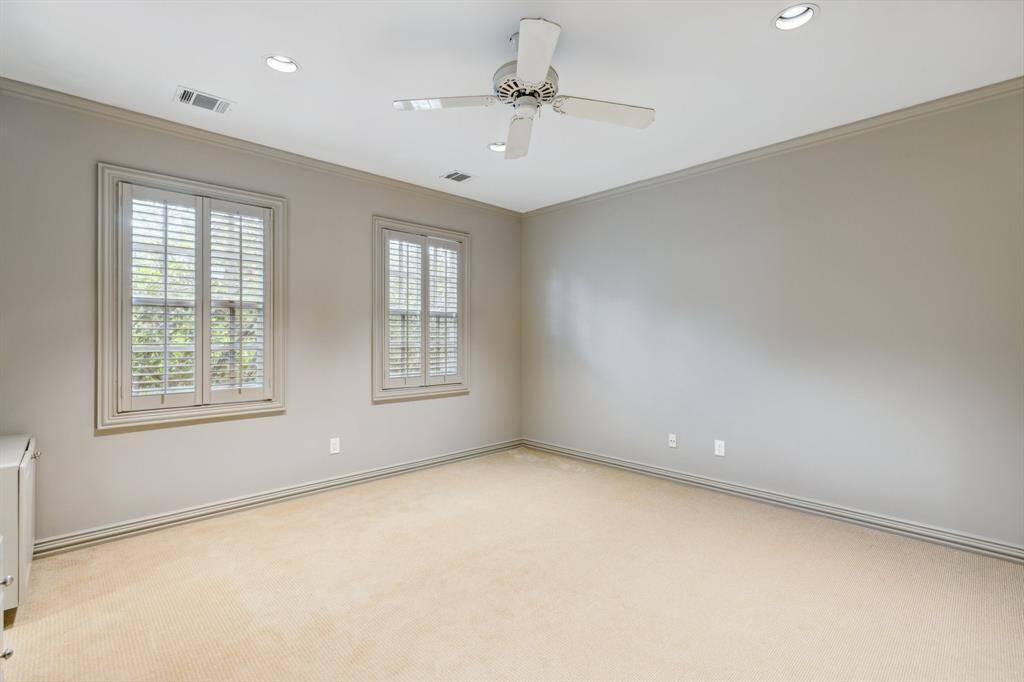 Secondary Bedroom #2 that is anything but secondary—bright, fresh, and sized just right for guests, kids, or a fabulous home gym. It is cozy and clean with style to spare. There is a built in desk for homework or other tasks. Paint 2025.