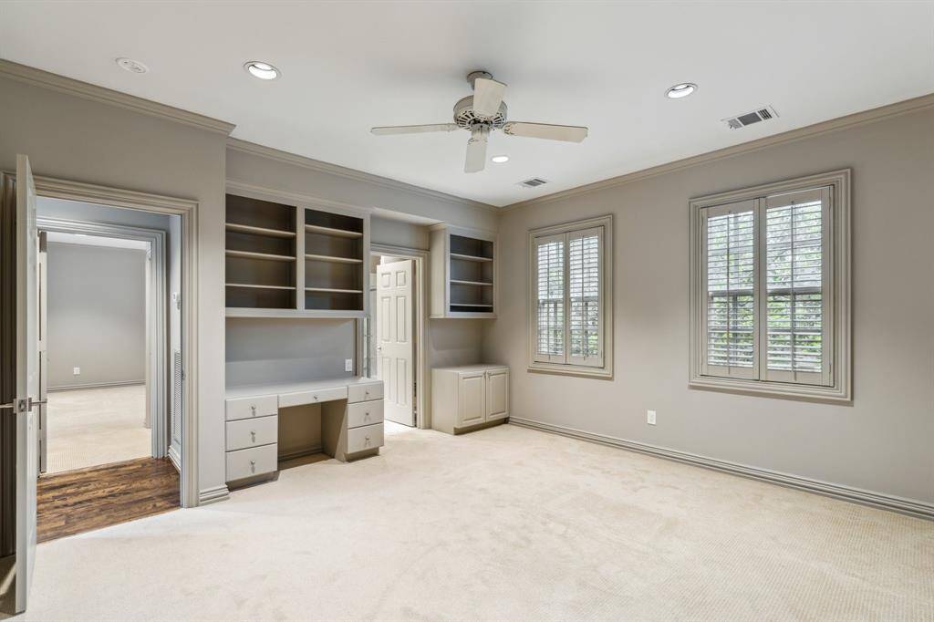 Need home office space with custom cabinetry and built-in desk? This charming third bedroom is filled with sunshine and positive vibes. Whether it is a guest room, playroom, or peaceful retreat, it has got flexibility and comfort all wrapped up.